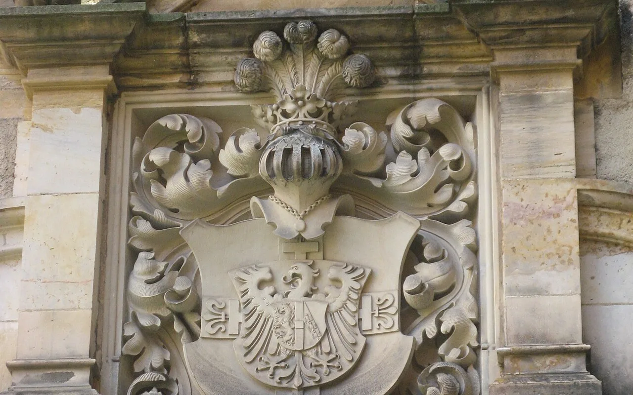 A carved coat of arms inside Bouzov Castle from the Teutonic Order's tenure