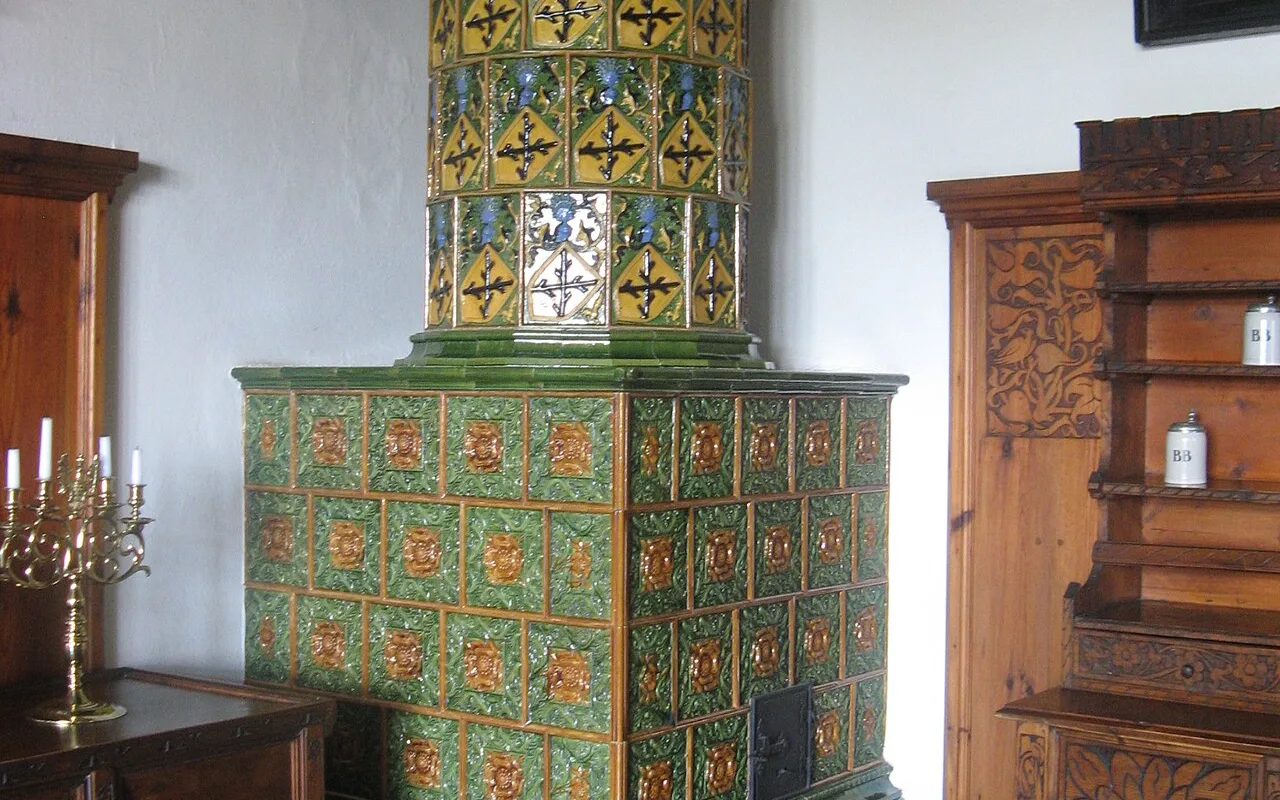 A tiled Gothic Revival stove inside one of Bouzov Castle's private rooms